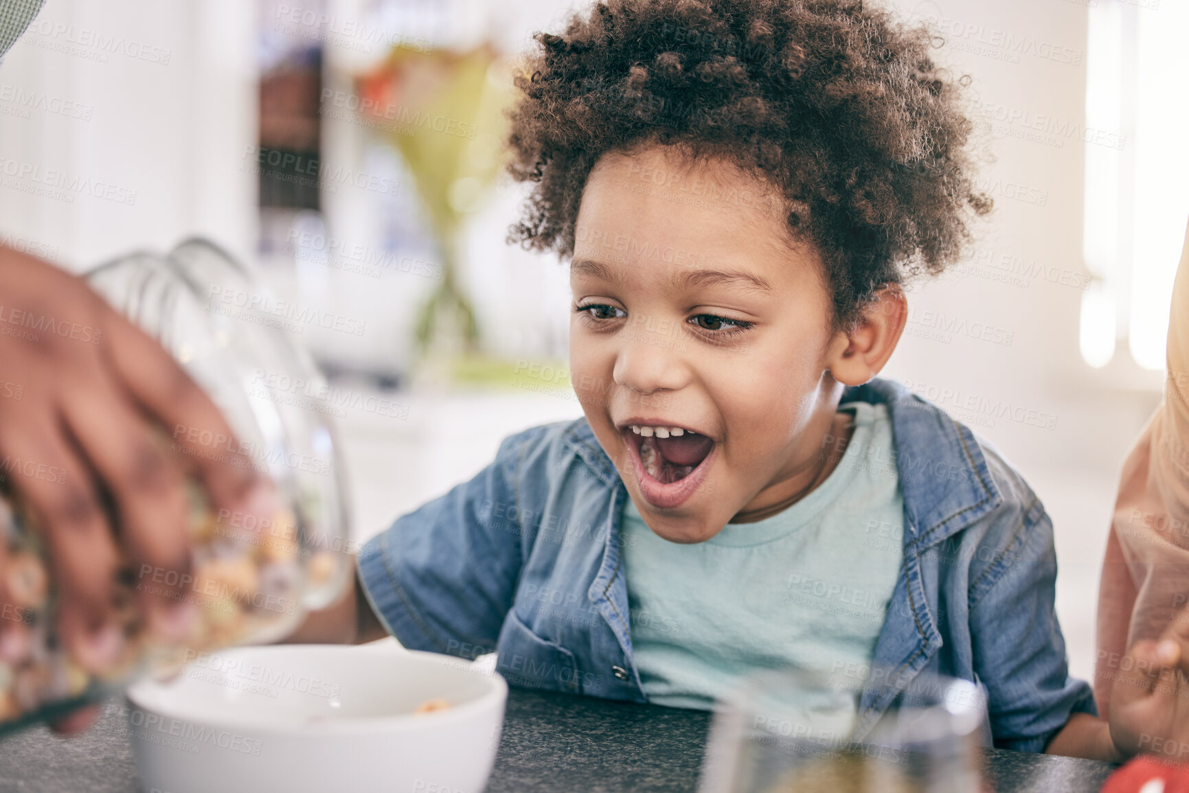 Buy stock photo Excited, happy and child ready for breakfast cereal in the morning feeling hungry for cornflakes in a home or house. Kid, food and young boy in the kitchen smile due to meal sitting at table