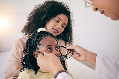 Buy stock photo Optometry, healthcare and optometrist with glasses for a child for eye care, vision or wellness. Optic health, ophthalmology and optician helping a girl kid with prescription spectacles in a clinic.