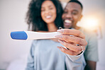 Pregnancy test, happiness and black couple in a home with a smile from baby news. Support, care and blurred background of a young and new mother and dad together feeling love with pregnant woman