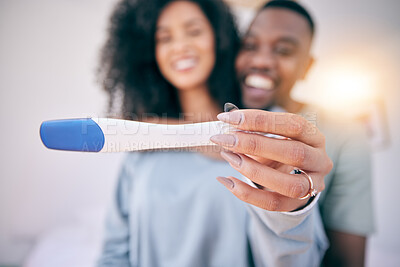 Buy stock photo Pregnancy test, happiness and black couple in a home with a smile from baby news. Support, care and blurred background of a young and new mother and dad together feeling love with pregnant woman