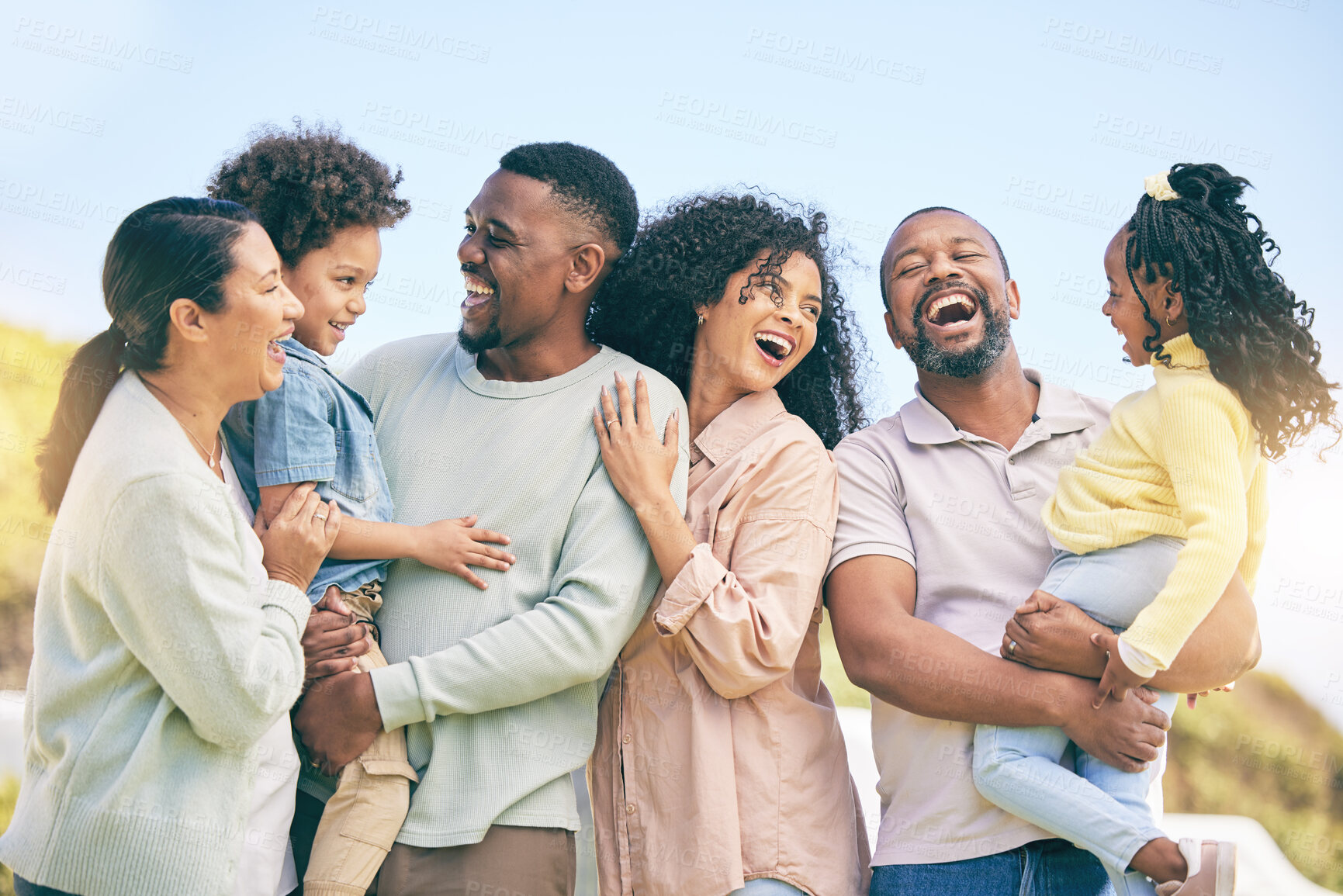 Buy stock photo Love, children and black family laughing in the garden of a home together, having fun outdoor during summer. Laughter, park or comic with parents, grandparents and kids bonding or joking outside