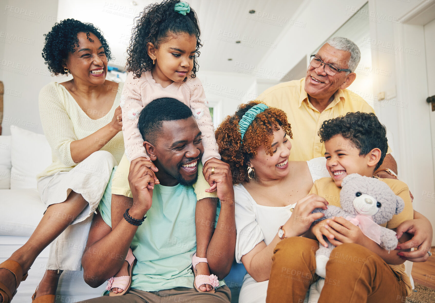 Buy stock photo Black family, smile and living room sofa with senior people, parent love and care in home. Lounge, happiness and children with mom and dad feeling happy with kids on couch with mama and grandparents