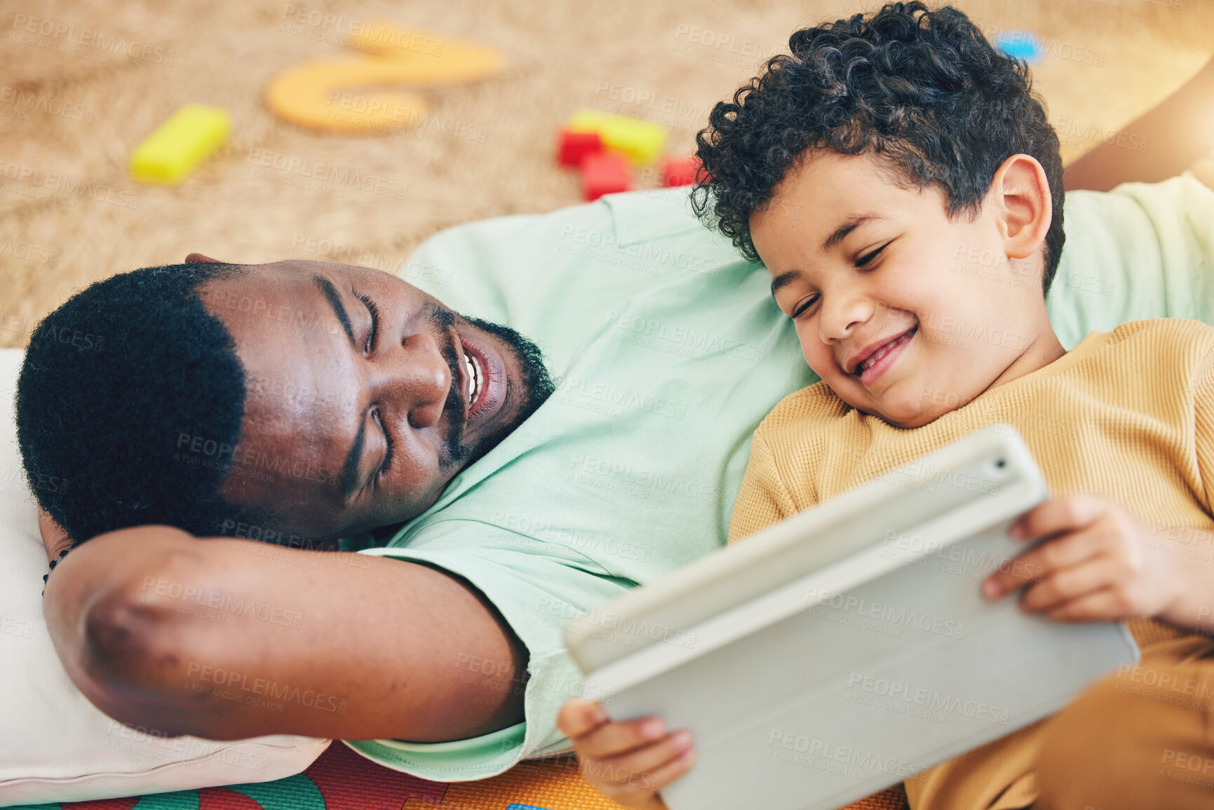 Buy stock photo Relax, streaming and tablet with father and son for elearning, bonding and watching subscription service. Happiness, technology and multimedia with black man and boy in family home for show and games