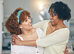 Hug, happy and a mother and daughter with admiration, love and laughing in the living room. Smile, affection and an African mom and woman hugging on mothers day during a visit or reunion together
