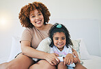 Mother, home and young girl portrait on a bed in the morning with toy in a family bedroom. House, smile and happy mom with a child with mama love and care for her kid with happiness while relaxing