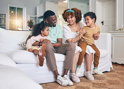 Buy stock photo Black family, lounge and living room sofa of a mother, father and children with happiness. Happy, smile and bonding of a mom, dad and young kids together having fun with parent love and support