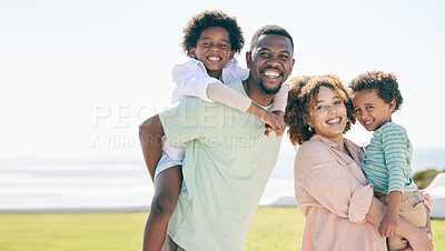 Buy stock photo Smile, happy and portrait of a black family at beach for travel, vacation and piggyback on nature mockup. Relax, face and trip with children and parents embrace and bond while traveling in Cuba