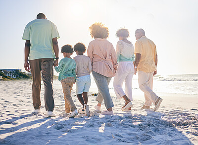 Buy stock photo Family walk on the beach, holding hands and generations with travel and summer vacation, solidarity and love outdoor. Grandparents, parents and children on holiday, people together with back view