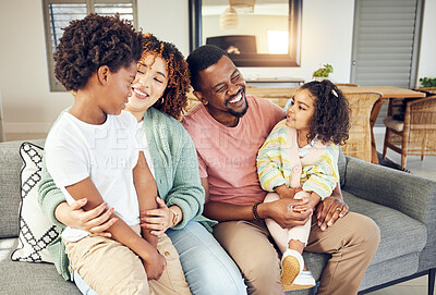 Buy stock photo Happy family, embrace and laugh on a sofa, cheerful and smile while bonding and relax in their home. Laughing, children and parents on couch together, hug and loving in a living room on weekend