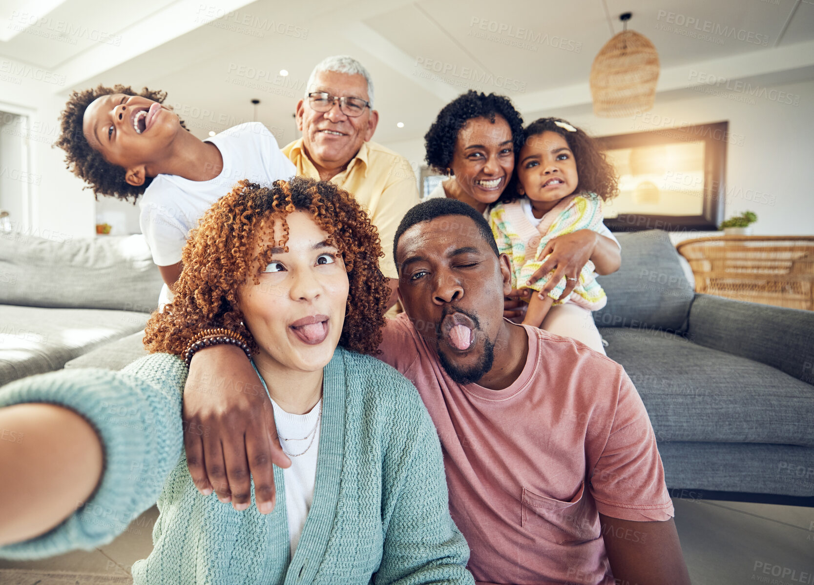 Buy stock photo Comic, selfie and grandparents with parents and children in living room to relax, bonding and quality time. Love, home and photo portrait of happy family and kids smile, funny face and laugh together