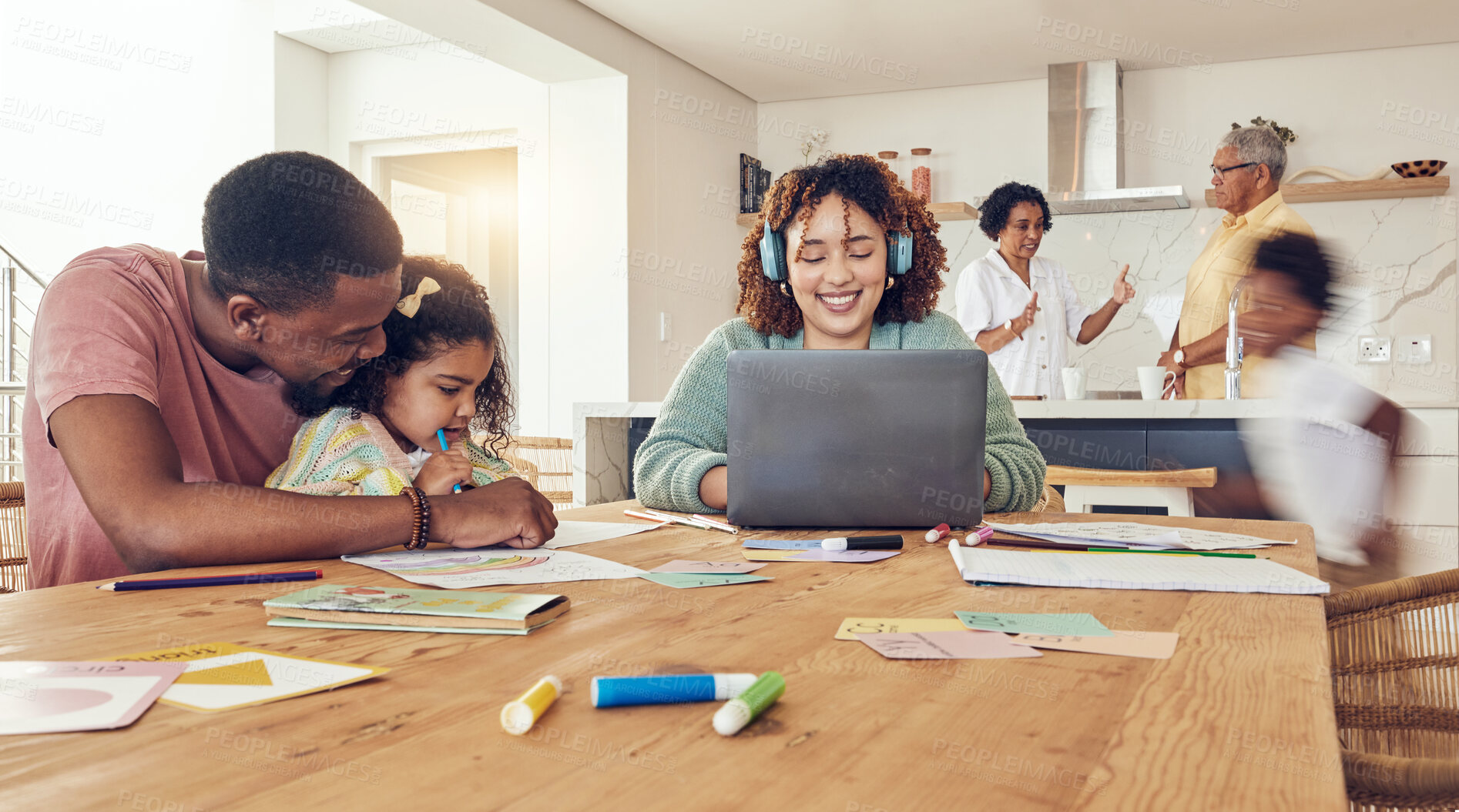 Buy stock photo Black family, education and learning on busy dining table together for childhood development at home. Happy dad helping daughter with homework while mother is working on laptop in the living room