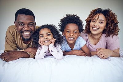 Buy stock photo Black family, portrait and relax in bed, happy and smile while bonding in their home together. Face, children and parents waking up in bedroom, lying and resting, having fun and enjoying the weekend