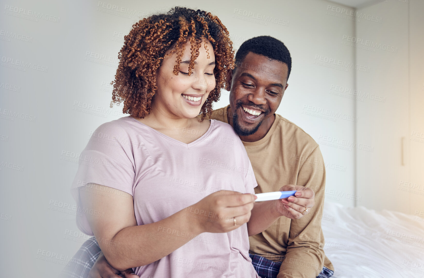 Buy stock photo Couple with pregnancy test results, fertility and people having a baby, happy with love and care at home. Interracial, black man and pregnant woman, start family with new mother and father with smile