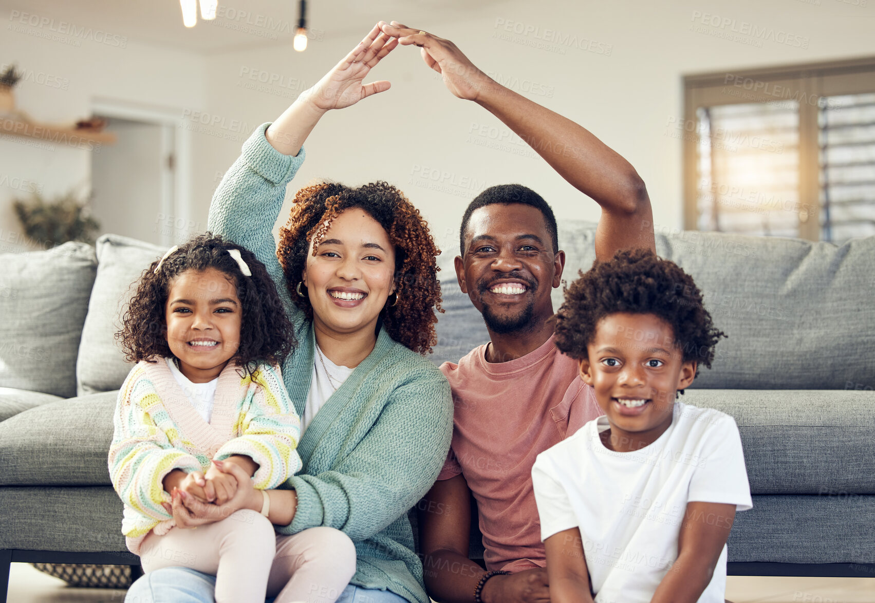 Buy stock photo Family, portrait and security, love and insurance for protection with parents and children. Hands together, roof and happy people in living room, unity and safety for life and home cover with smile
