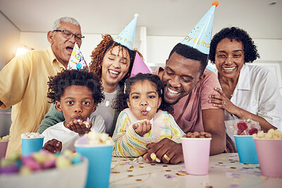 Buy stock photo Birthday party, blow and confetti with family in kitchen for celebration, bonding and affectionate. Happy, excited and grandparents with parents and children at home for surprise, fun or event 