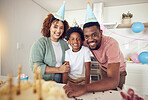 Birthday, party and portrait of black family in kitchen for celebration, bonding and affectionate. Happiness, excited and care with parents and child at home for surprise, fun and special event 