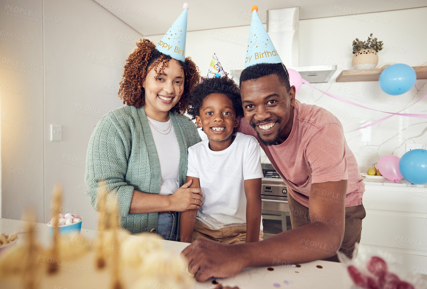 Buy stock photo Birthday, party and portrait of family in kitchen for celebration, bonding and affectionate. Happiness, excited and care with parents and child at home for surprise, fun and special event 