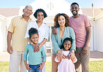 Diversity, happy and portrait of an interracial family with a smile, happiness and care on the lawn. Visit, together and parents, grandparents and children with love, smiling and bonding in garden