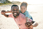 Black family, beach and a piggyback daughter with her father outdoor in nature together during summer. Portrait, smile or fun with a happy dad and girl child bonding on the sand by the ocean or sea