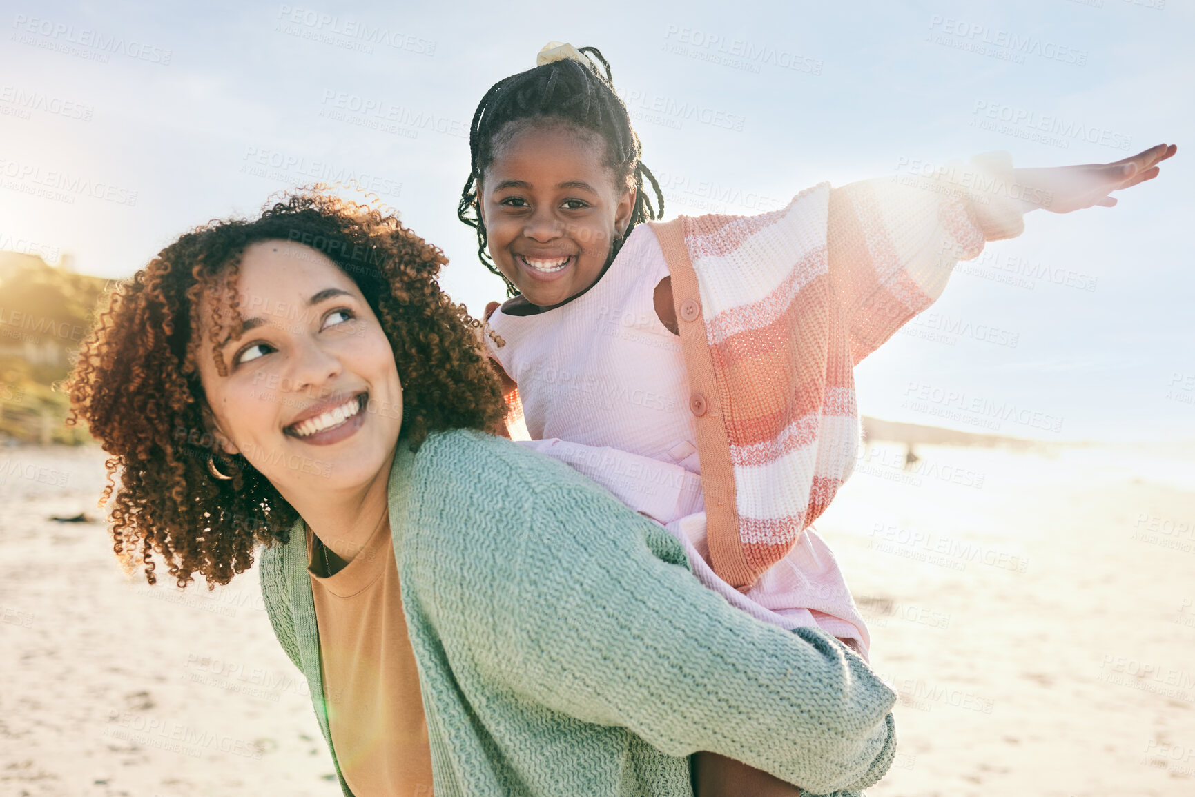 Buy stock photo Portrait, fly or girl with mother at beach on summer holiday vacation together as a happy family. Fun African mom, piggyback or excited young child love bonding, relaxing or playing in nature or sea