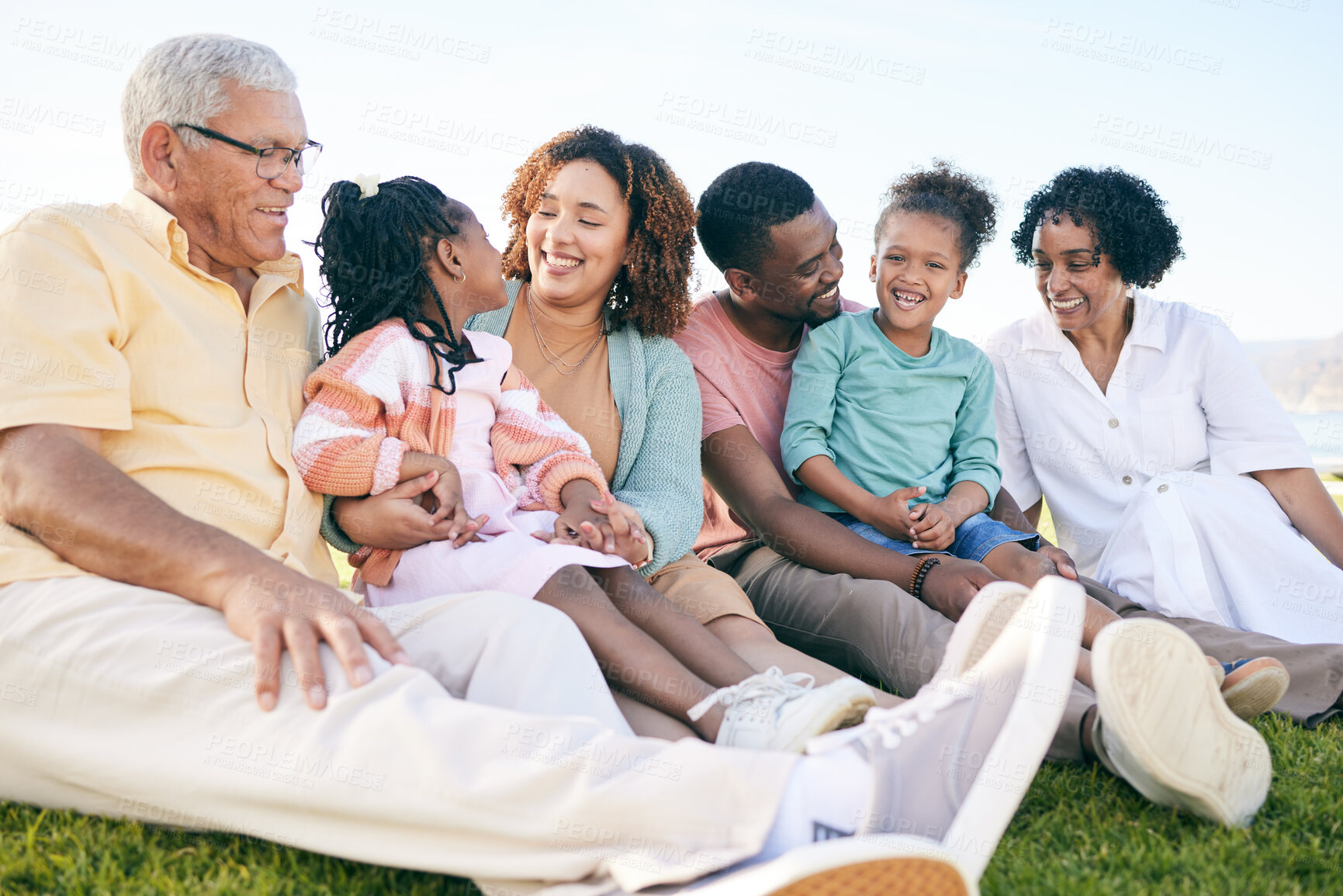 Buy stock photo Family, smile and generations outdoor, happy people relax on lawn with grandparents, parents and kids. Happiness, unity and sitting together on grass, diversity and love with relationship and bond