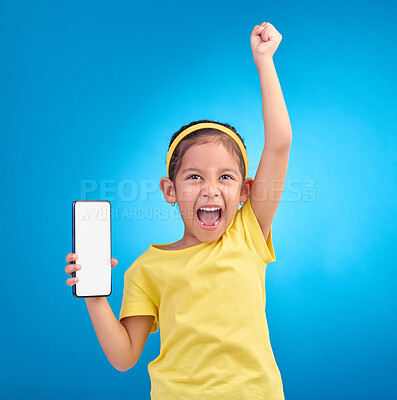 Buy stock photo Phone, winner and child with mockup screen on blue background for social media, website and mobile app. Advertising, brand space and girl happy, excited and celebration for success, goals and winning