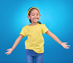 Mockup, excited and girl with smile, space and celebration against blue studio background. Happy, female child or young person with open arms, happiness and fashion kid outfit with joyful or cheerful