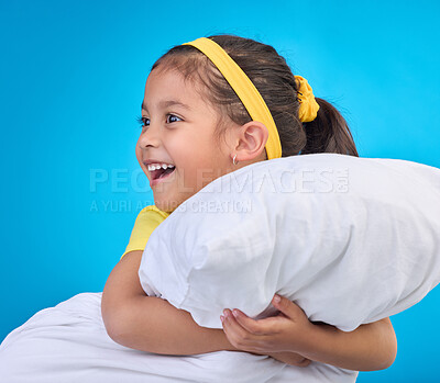 Buy stock photo Happy, cute and child with a pillow for sleep isolated on a blue background in a studio. Smile, excited and a young little girl thinking of sleeping, getting ready for a nap or rest on a backdrop