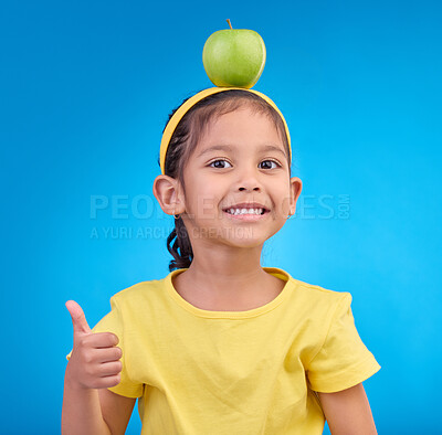 Buy stock photo Happy, portrait and a young girl with a thumbs up isolated on a blue background in a studio. Review, success and face a child with a hand gesture for satisfaction, emoji and agreement on a backdrop