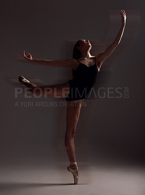 Buy stock photo Flexibility, dance and woman in the dark for ballet isolated on a black background in a studio. Creative, elegant and dancer dancing for a theater performance, rehearsal or ballerina movement