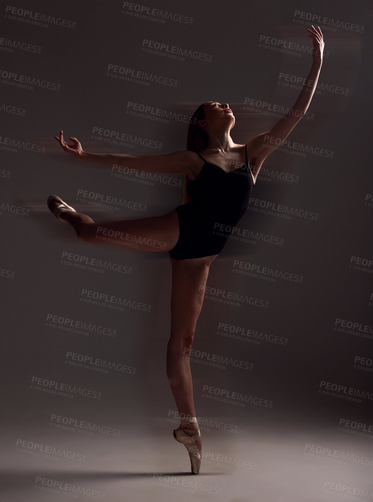 Buy stock photo Flexibility, dance and woman in the dark for ballet isolated on a black background in a studio. Creative, elegant and dancer dancing for a theater performance, rehearsal or ballerina movement