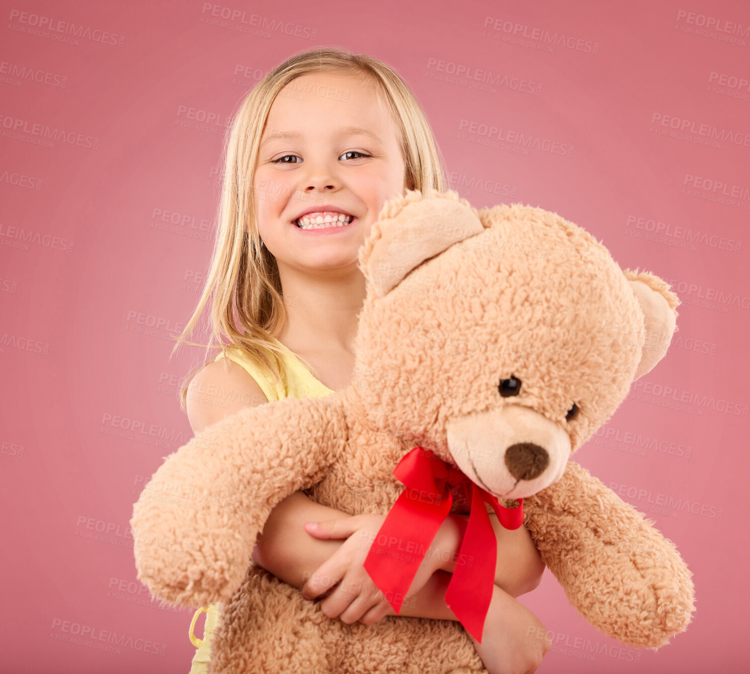 Buy stock photo Teddy bear hug, girl smile and portrait with a toy with happiness and love for toys in a studio. Isolated, pink background and a young female child feeling happy, joy and cheerful with stuffed friend
