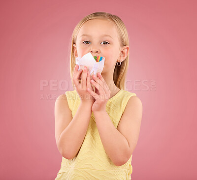 Buy stock photo Girl child, cupcake and portrait in studio on a pink background while eating cake. Face of a female kid model with a sweet snack, creativity and paper in hand isolated on color and a gradient space