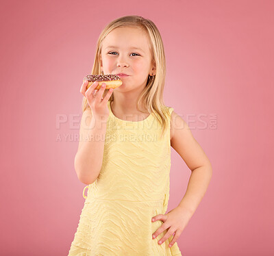 Buy stock photo Portrait, girl child and donuts on pink background, studio and color backdrop for dessert, sweet treat and sugar. Happy young kid eating doughnut, baked snack and delicious round pastry of junk food