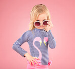 Holiday, portrait of child in studio with sunglasses and fun clothes and hat isolated on pink background. Summer, vacation and fashion, happy girl in Australia excited for travel with smile on face.