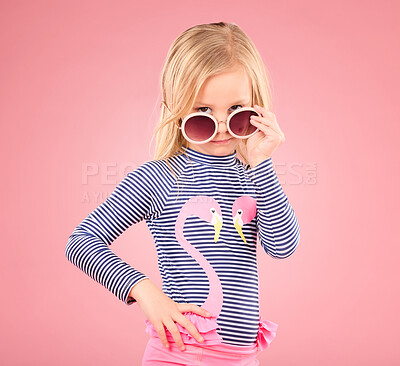 Buy stock photo Holiday, portrait of child in studio with sunglasses and fun clothes isolated on pink background. Summer, vacation and fashion for children, girl in Australia on travel in serious face and beachwear