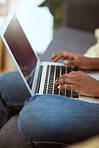 Laptop, female and hands typing on a keyboard while working on a freelance project at her house. Technology, research and closeup of woman working on a report with a computer in living room at home.