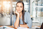 Woman designer, portrait and smile at desk in office for paperwork, pride or expert engineering in Canada. Happy young female architect at desk with confidence of planning strategy in startup company