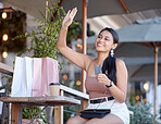 Credit card, shopping and a woman with coffee at a cafe, calling and customer at a restaurant. Payment, happy and a girl waving for attention at a diner to pay, buy take away and spend on lunch