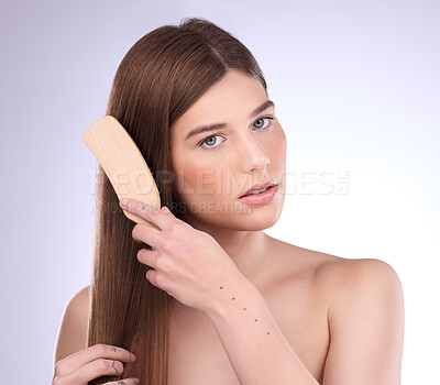 Buy stock photo Portrait, beauty and woman brushing hair in studio for for shiny, healthy and growth results on grey background. Face, haircare and brush by girl model relax with luxury comb for smooth care or shine