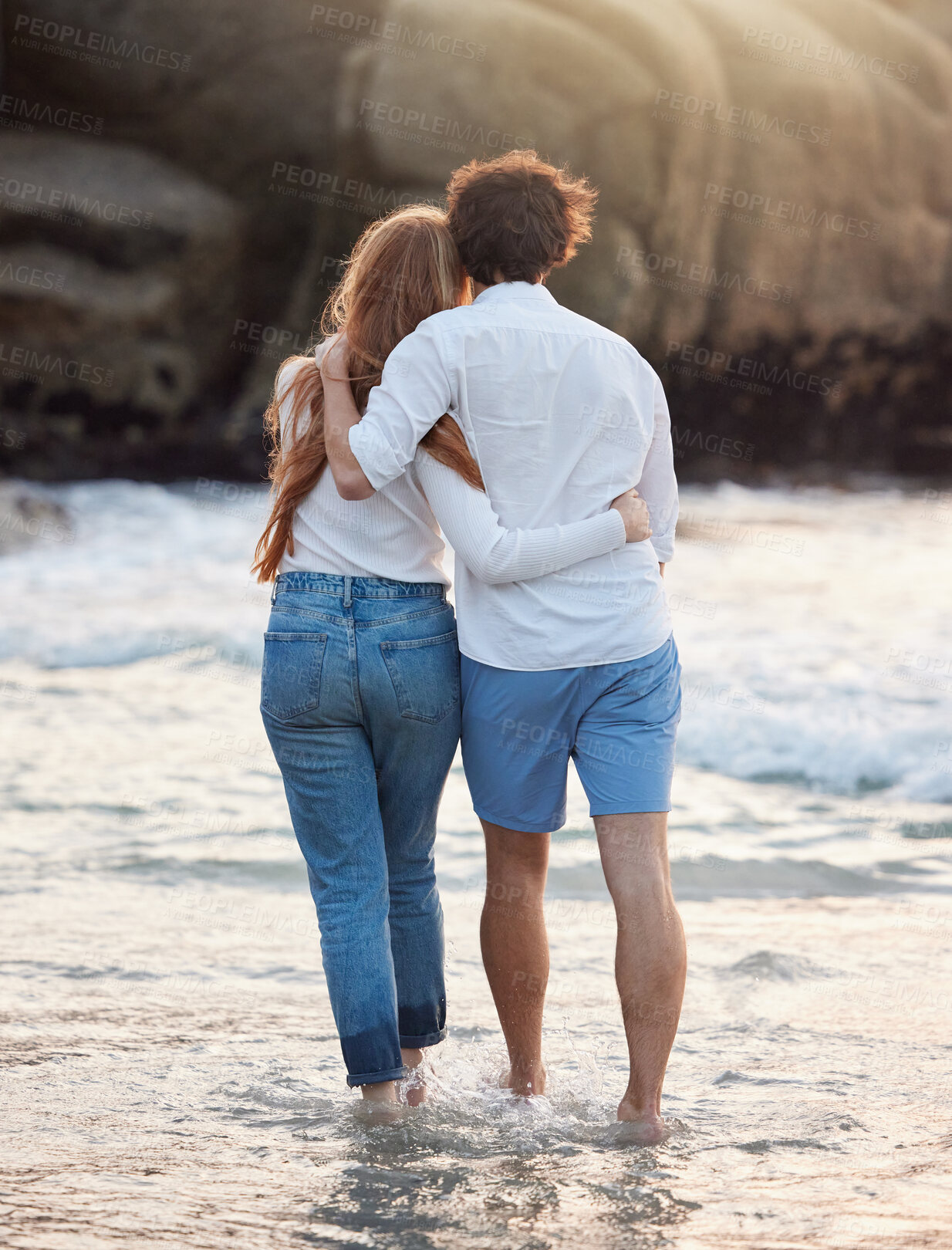 Buy stock photo Back, hug and couple walking, beach and quality time on summer vacation, weekend break and romance. Romantic, man and woman embrace, love and happiness for holiday, journey and adventure together