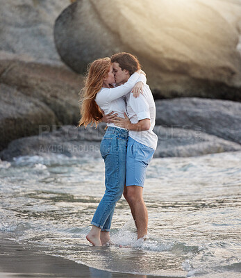 Buy stock photo Love, kiss and happy with couple at beach for romance, relax and vacation trip. Travel, sweet and cute relationship with man and woman kissing on date for summer break, affectionate and bonding