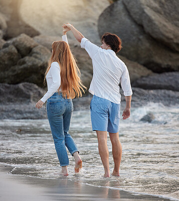 Buy stock photo Love, dance and happy with couple at beach for romance, relax and vacation trip. Travel, sweet and cute relationship with man and woman holding hands on date for summer break, trust and bonding