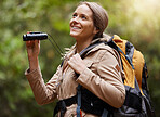 Nature, hiking and woman with binoculars, adventure trail on holiday in African game reserve. Trekking, trees and forest hike, sightseeing and person with smile on happy mountain walk in South Africa