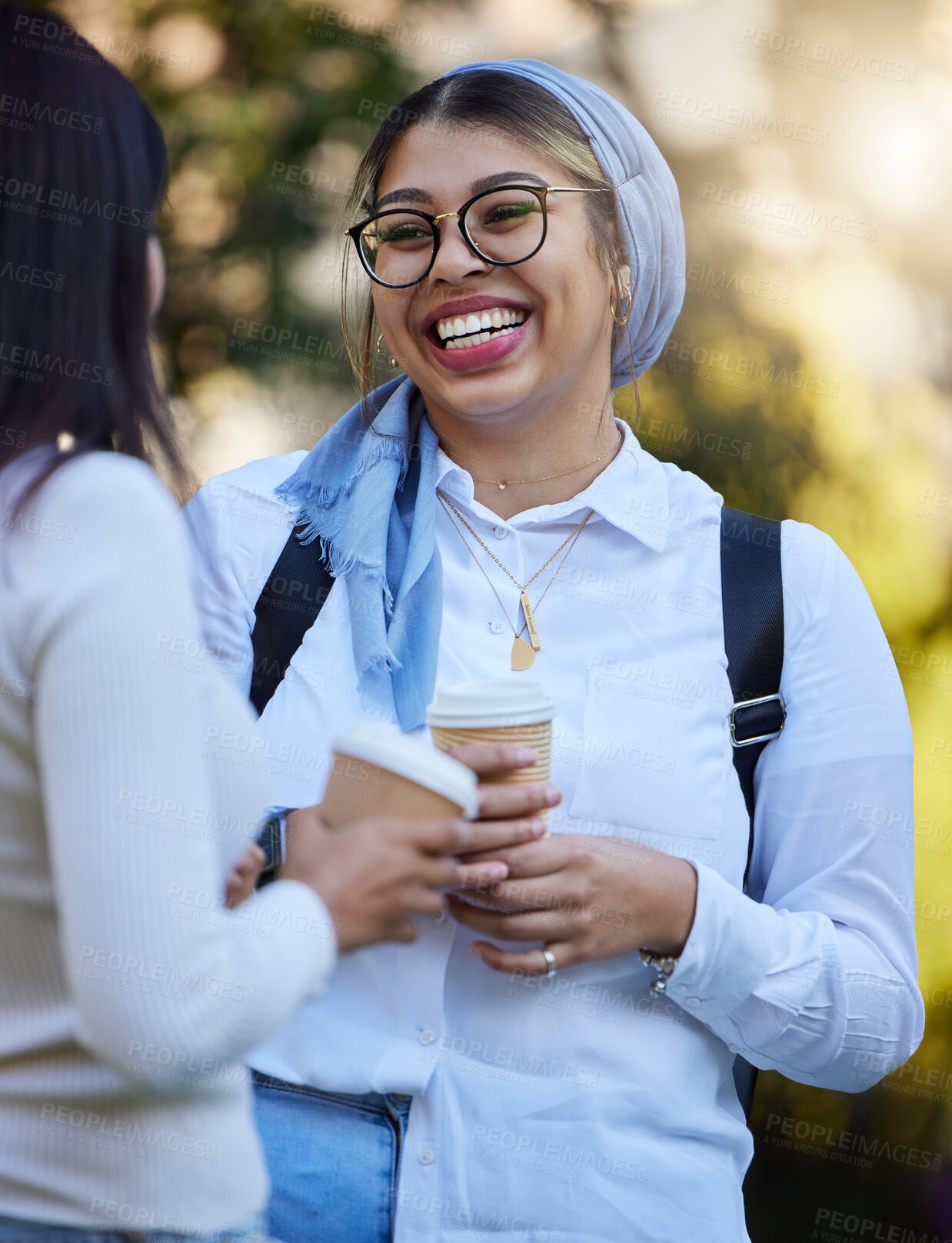 Buy stock photo Laughing, break or university friends at park on campus for learning, education or goals together. Funny girls Muslim or students relaxing with school books meeting for research or college knowledge