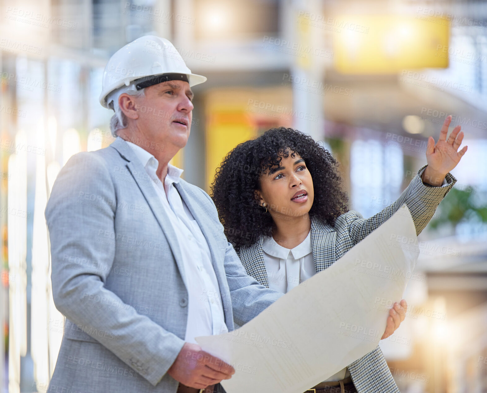 Buy stock photo Man, woman and pointing at construction site for blueprint ideas, industrial design or collaboration. Team discussion, building management and engineering of infrastructure, architecture and planning