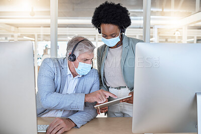 Buy stock photo Covid, call center and coaching employees with mask at computer, help for senior man and black woman with tablet. Compliance, consulting and sharing opinion for medical advisory agency with diversity