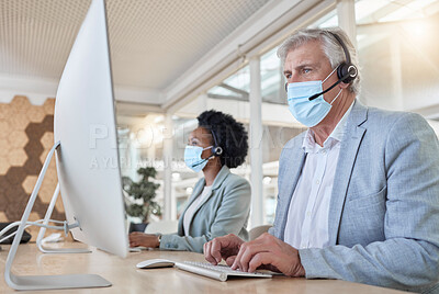 Buy stock photo Covid, help desk employees with mask at computer and mature man and black woman in call center. Office compliance, consulting team online in coworking space and medical advisory agency with diversity