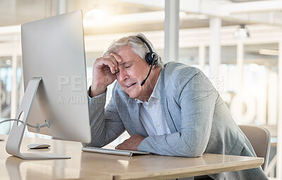 Buy stock photo Call center, customer support and headache with a consultant man suffering from pain while working in the office. Crm, service and burnout with a senior male telemarketing working feeling stress