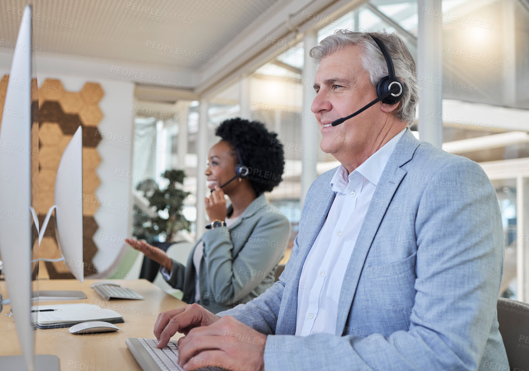 Buy stock photo Crm, smile and call center employees at computer in coworking space with senior man with black woman. Office, consulting team and diversity at online advisory agency happy consultant at crm help desk